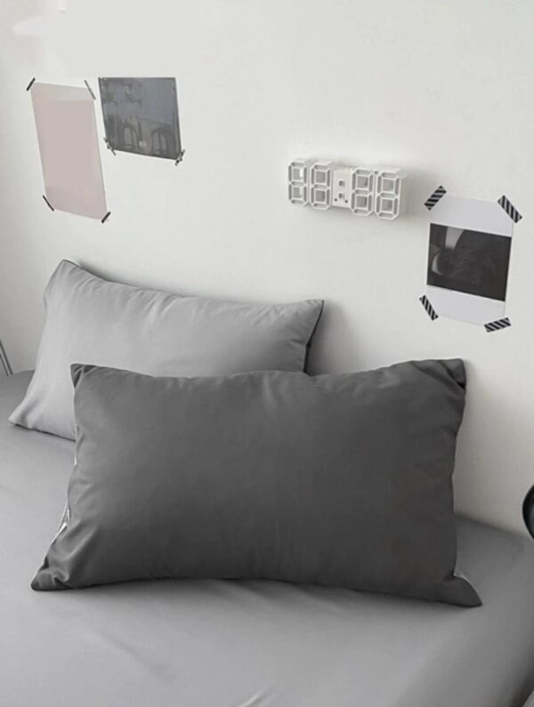 dark grey and light grey pillowcases