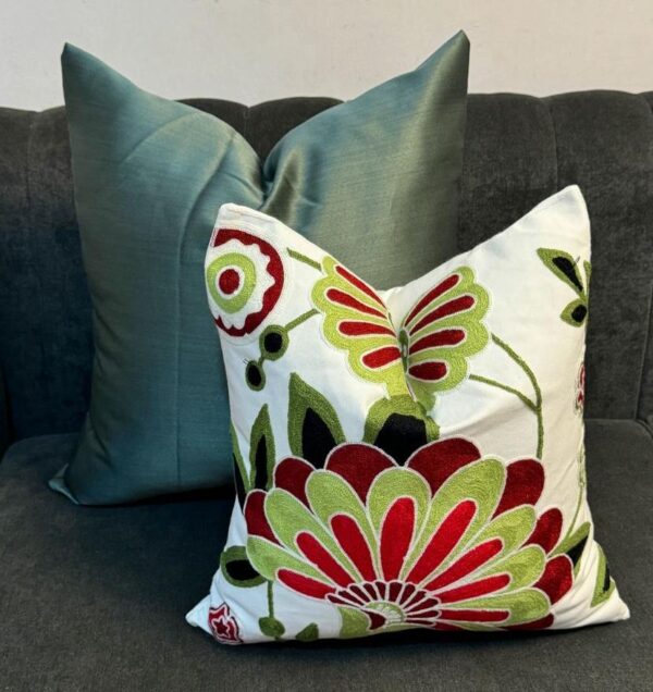 red floral throw pillow