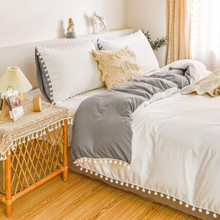 white and grey pom pom bedding set