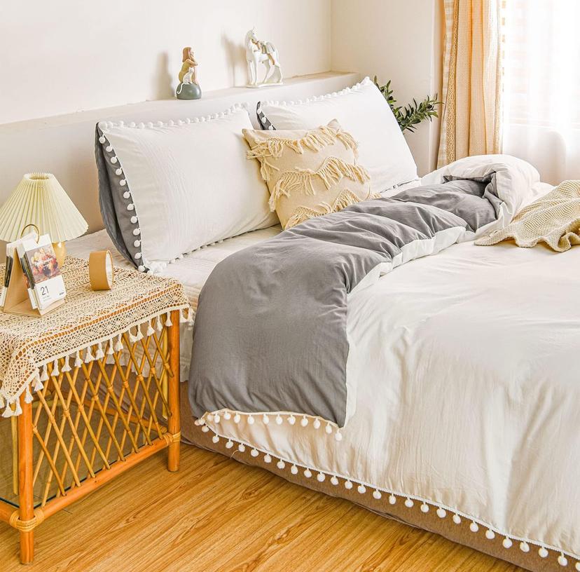 white and grey pom pom bedding set