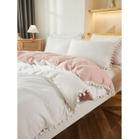 white and pink pom pom bedding set